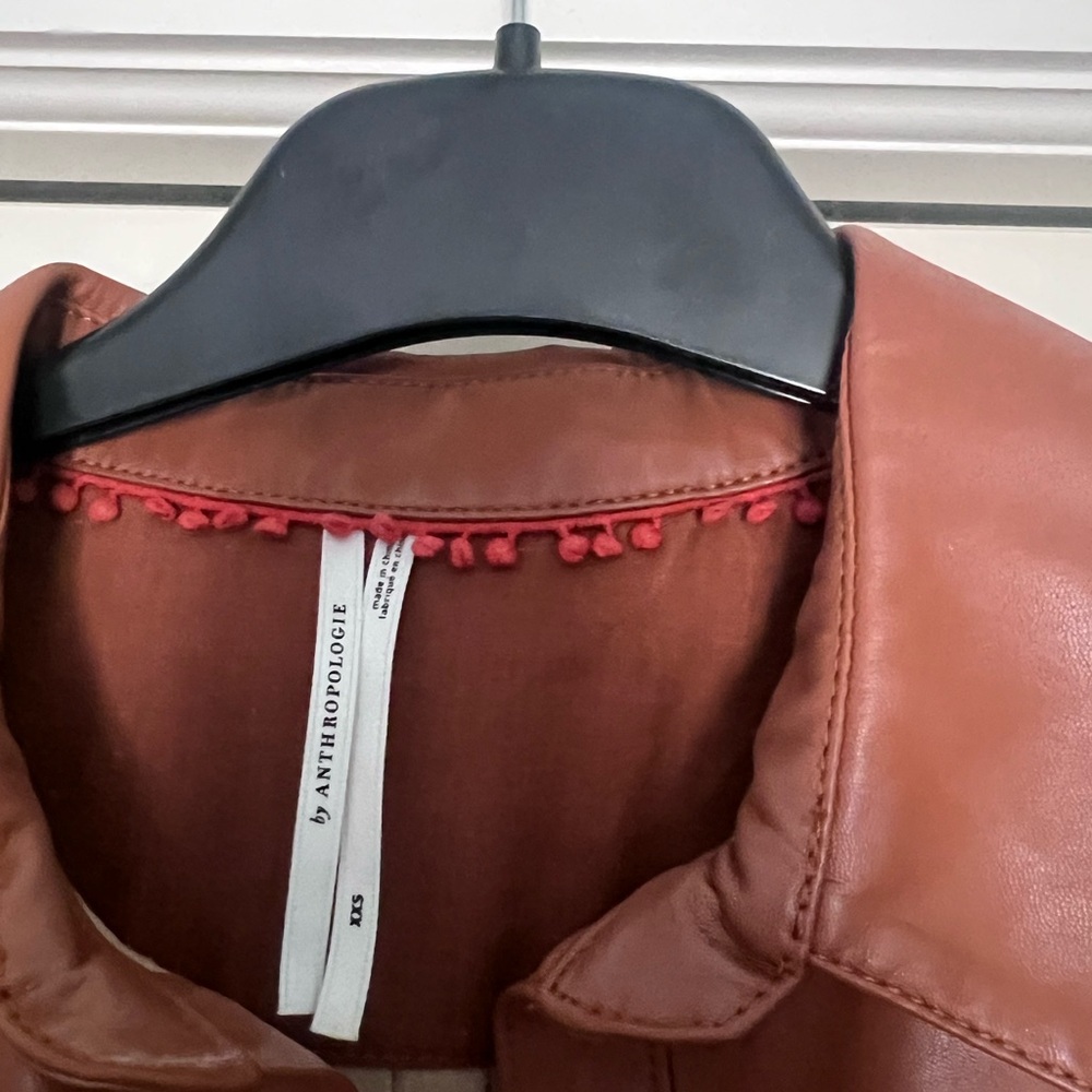 Anthropologie Burnt Orange Faux Leather Jacket with Pom-Pom Trim